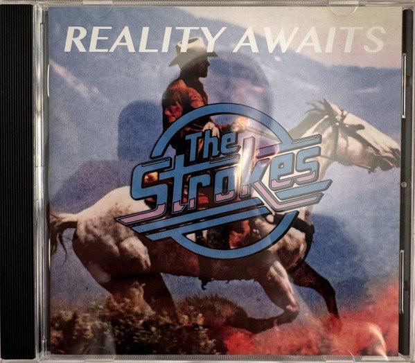 THE STROKES - REALITY AWAITS